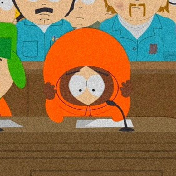 a picture of kenny (i don't need to specify he's from south park right? right??) holding his head in his hands. the background seems to depict a conference room or court. he seems deeply disturbed by whatevers going on.